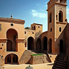 Tranquil courtyard with warm-hued walls and bell tower