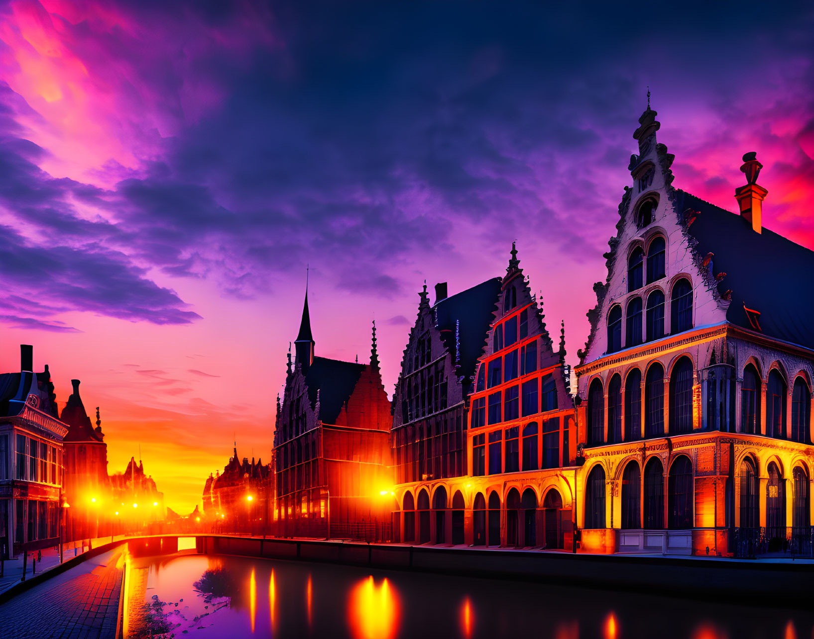 Historic European buildings by canal: vibrant purple and orange sunset reflection.