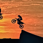 Two motorcyclists in mid-air with ship, city, and lone figure in silhouette.