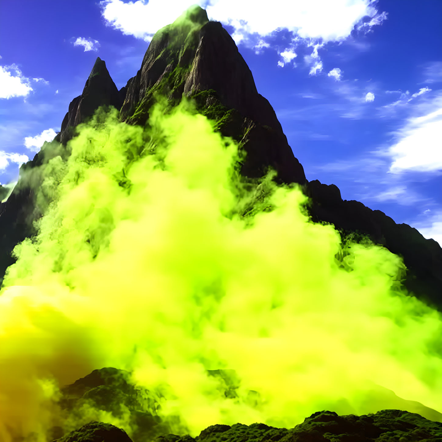 Majestic mountain peaks under blue sky with green-yellow fog