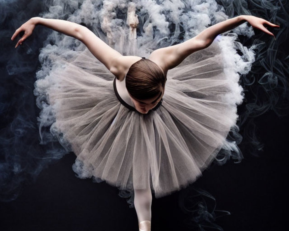 Ballet dancer in pointe shoes and tutu amidst swirling smoke