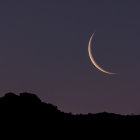 Stylized nighttime landscape with crescent moon and stars