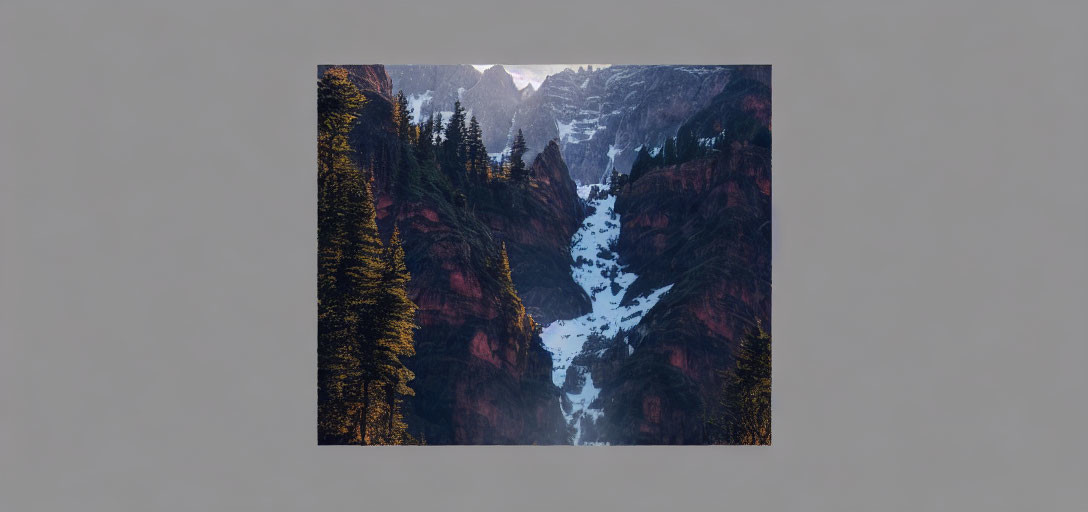 Snow-covered Mountainous Landscape with Waterfall and Evergreen Trees