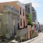 Classic Cityscape: Sunny Streets, Shops, and People Walking