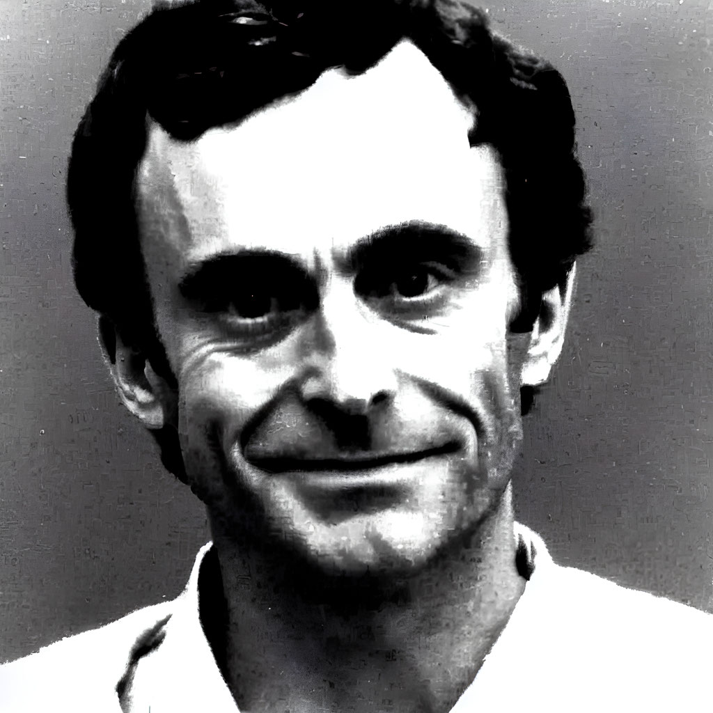 Smiling man with intense eyes in black and white photo