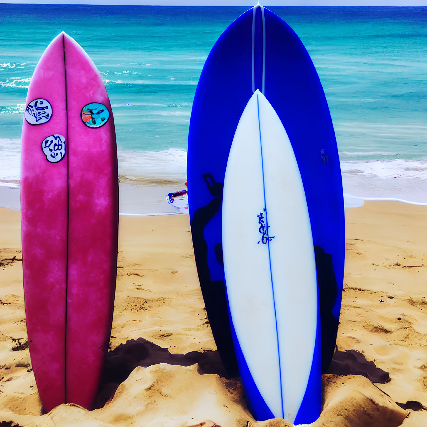 Colorful Surfboards with Stickers on Beach Sand by Tranquil Sea