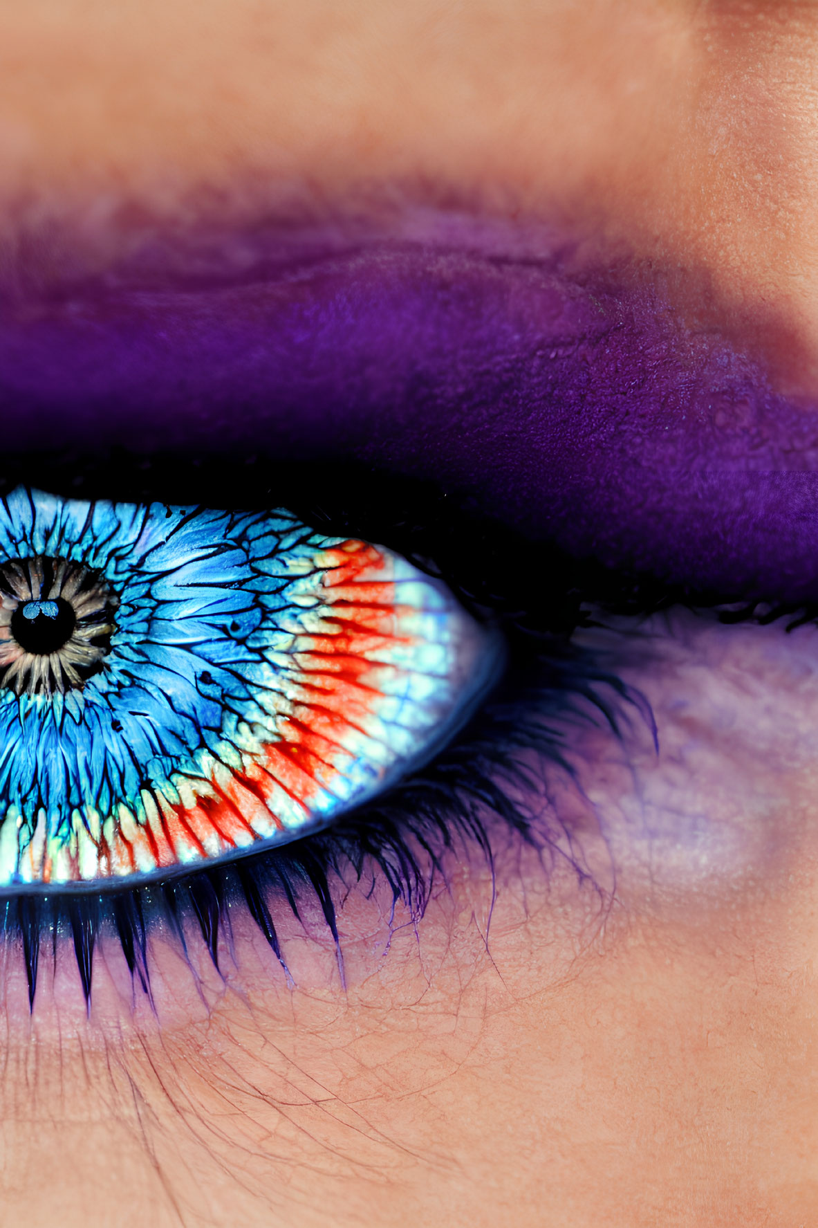 Blue eye with colorful iris, purple eyeshadow, blue eyeliner, and mascara lashes