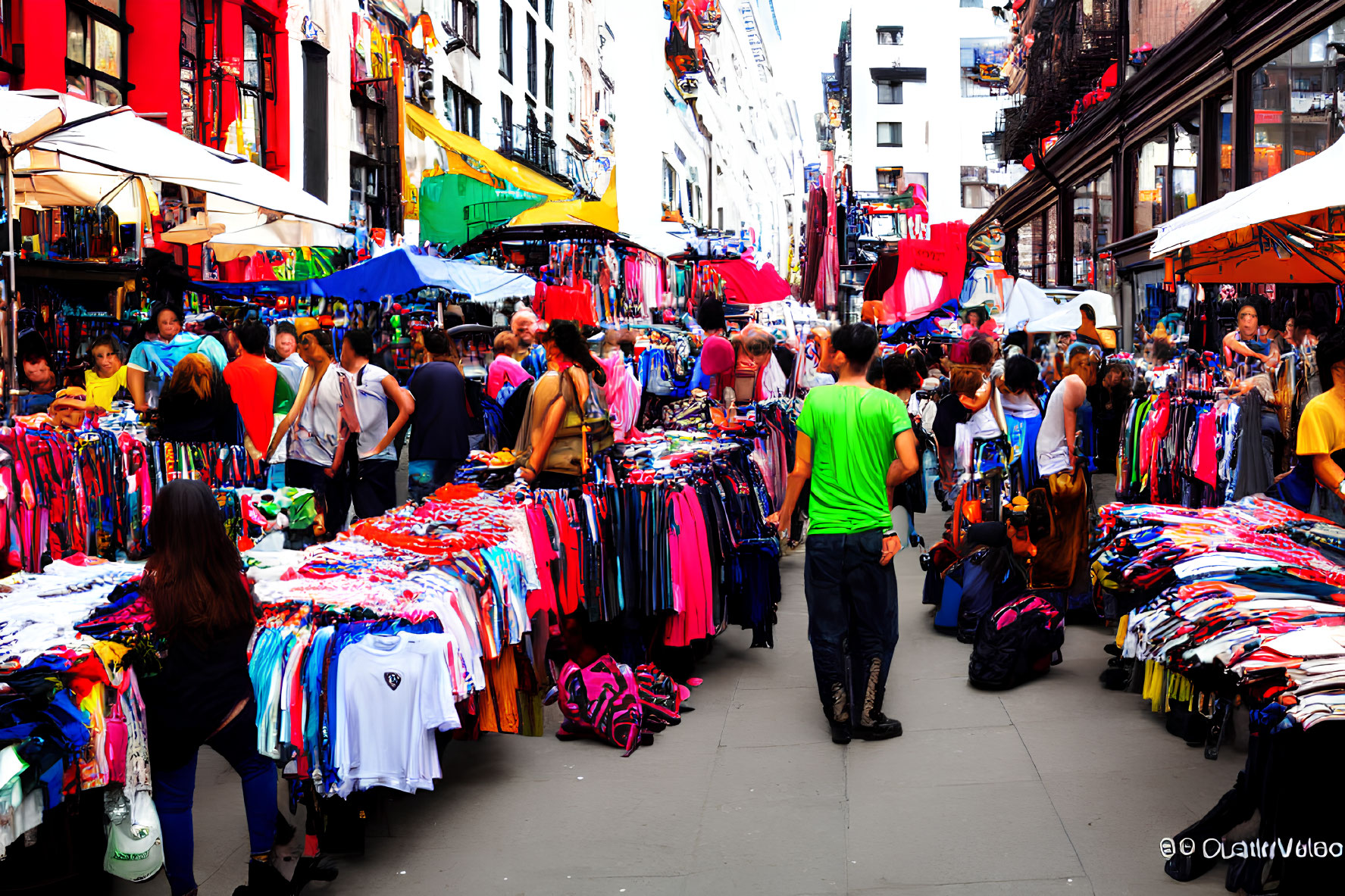 Colorful Clothing and Bustling Stalls at Vibrant Street Market