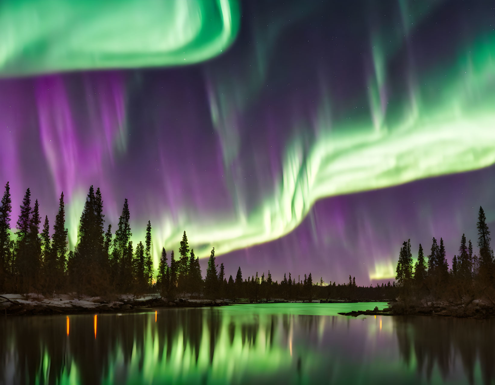 Colorful Aurora Borealis Reflecting in Lake at Night