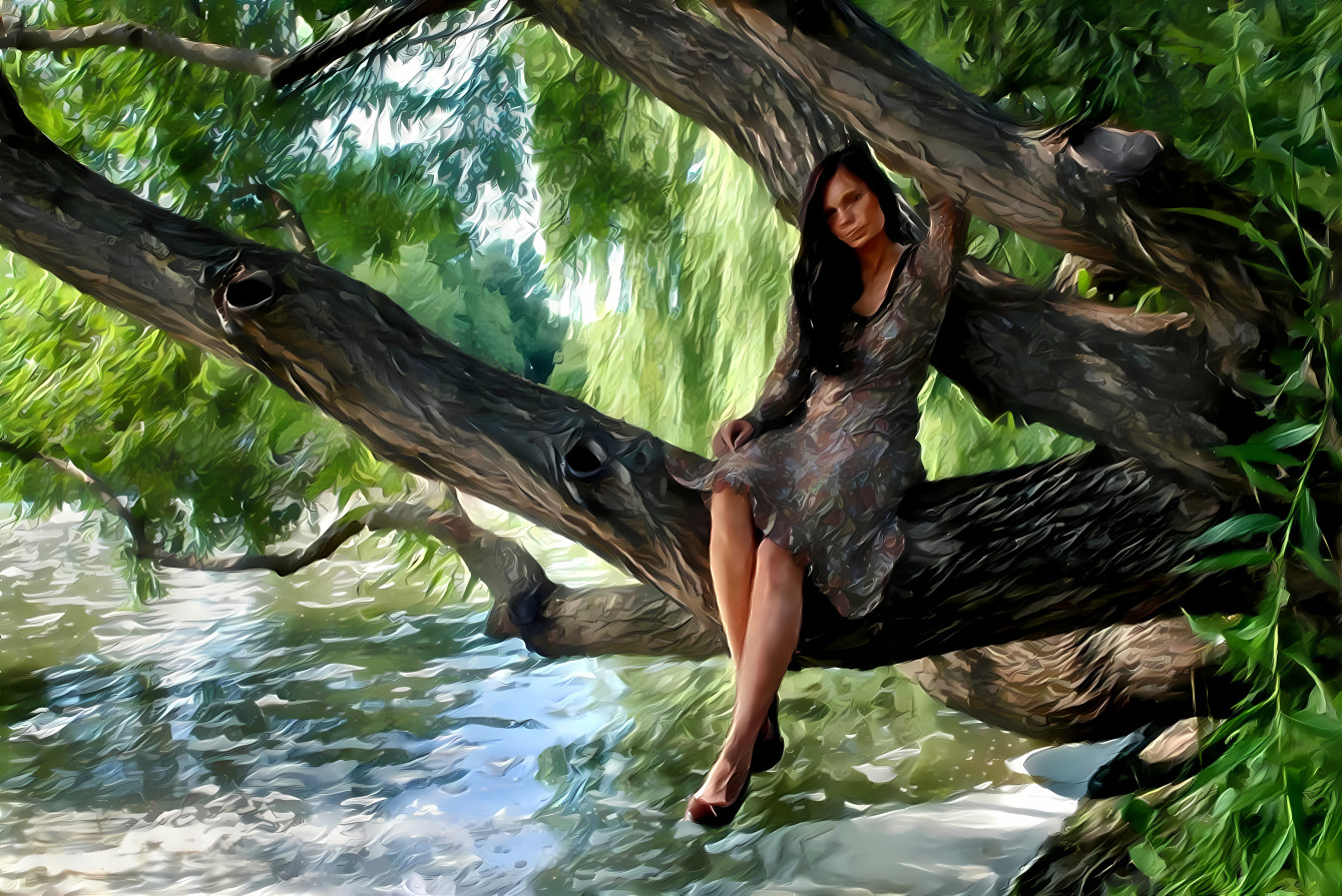 Tree branch over water and woman