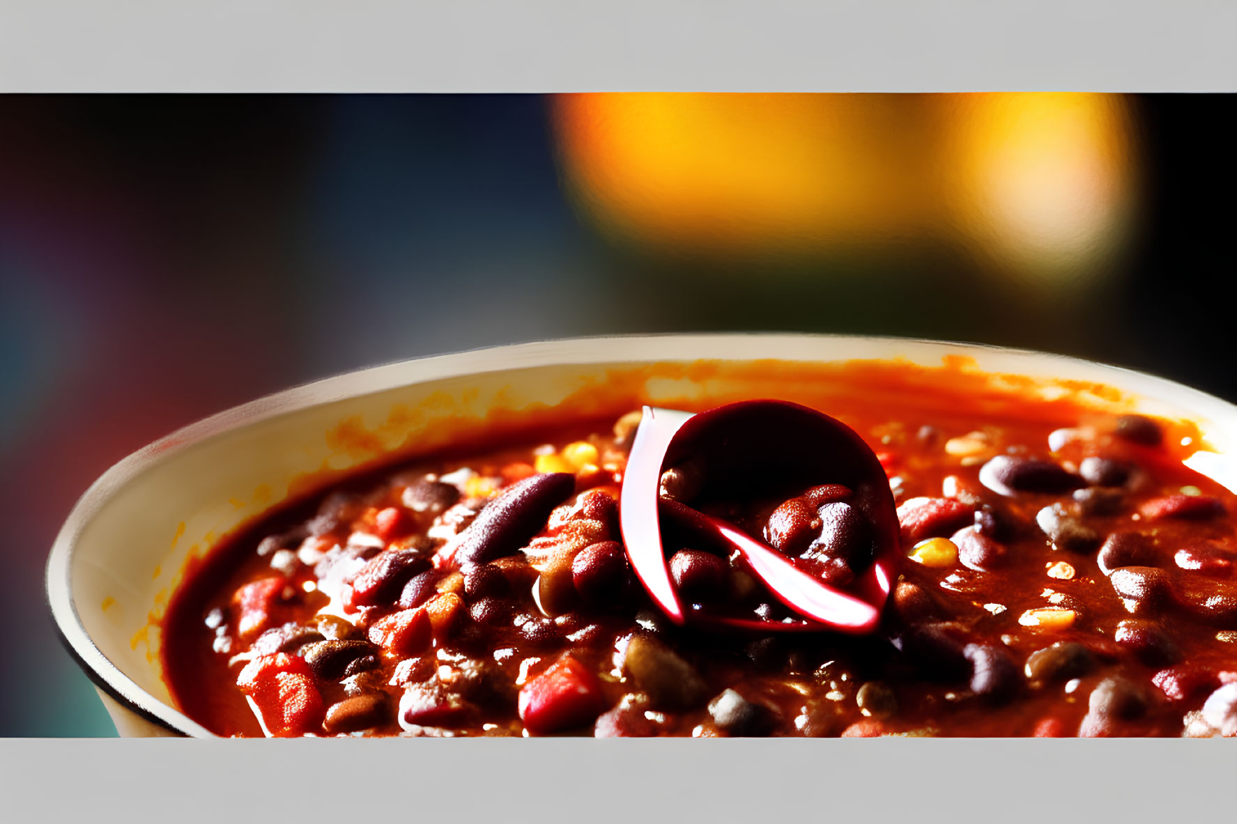 Close-Up of Spicy Chili Bowl with Beans and Red Chili Pepper