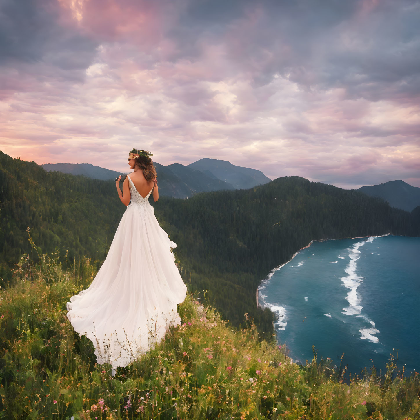 Woman in white dress gazes at lake and mountains from hilltop