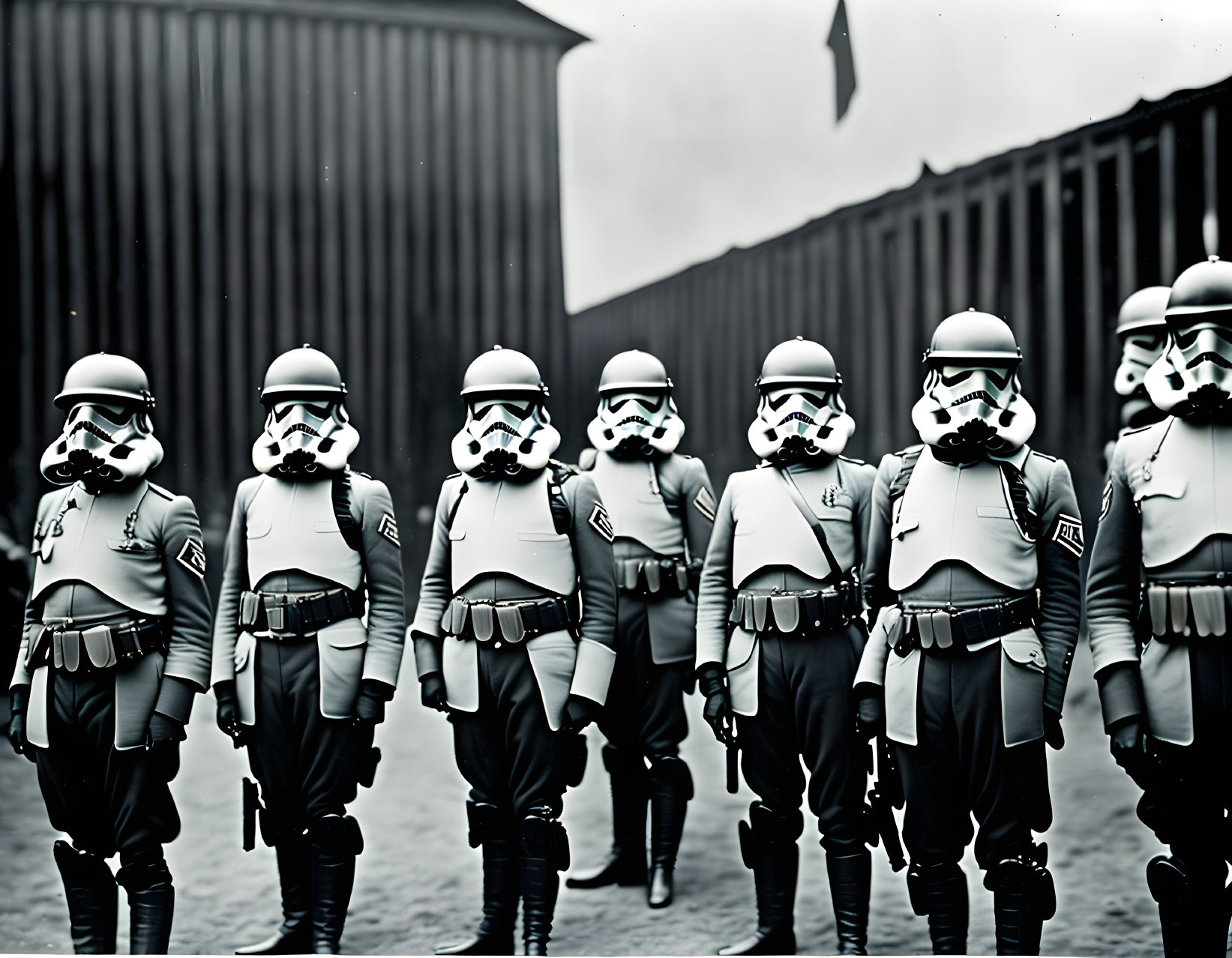 Group of seven stormtroopers in full armor formation with dark building