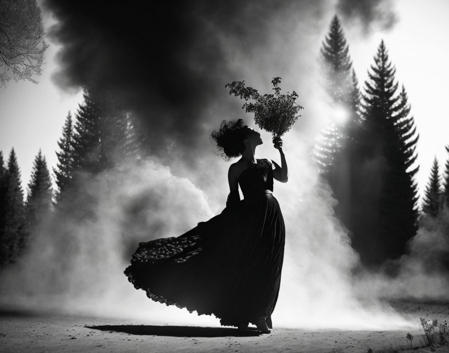 Monochrome image of woman in flowing dress with bouquet and smoke plume in forest.