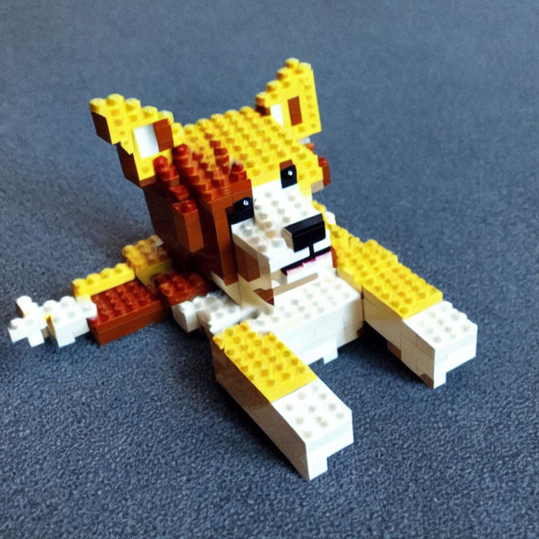 Yellow and Orange Lego Dog Model on Blue Background