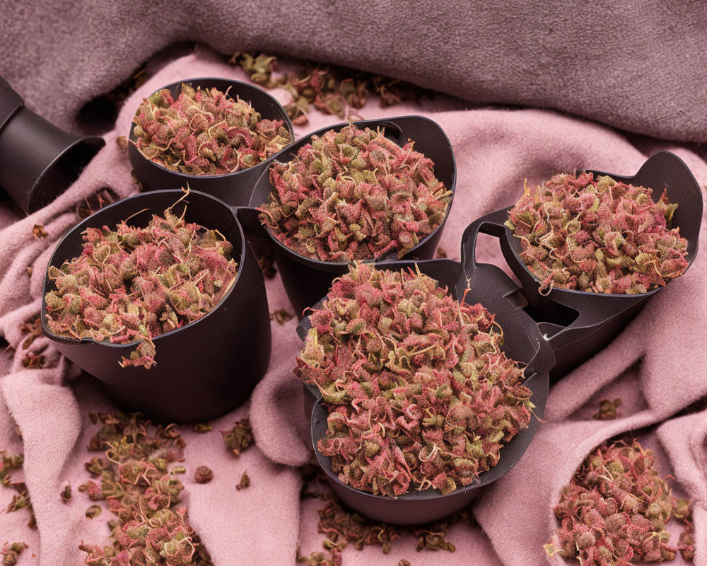 Measuring Spoons with Pink Flower Buds on Textured Fabric