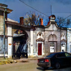 Vintage Street Scene Watercolor Painting with Classical Architecture and Parked Car