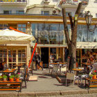 Colorful street scene with whimsical buildings, vibrant flowers, and patterned pavement