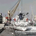 Harbor scene digital painting with white crane ship and industrial buildings