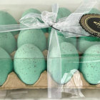 Ornate Teal and Gold Easter Eggs with Glitter and Jewels Displayed with Bow