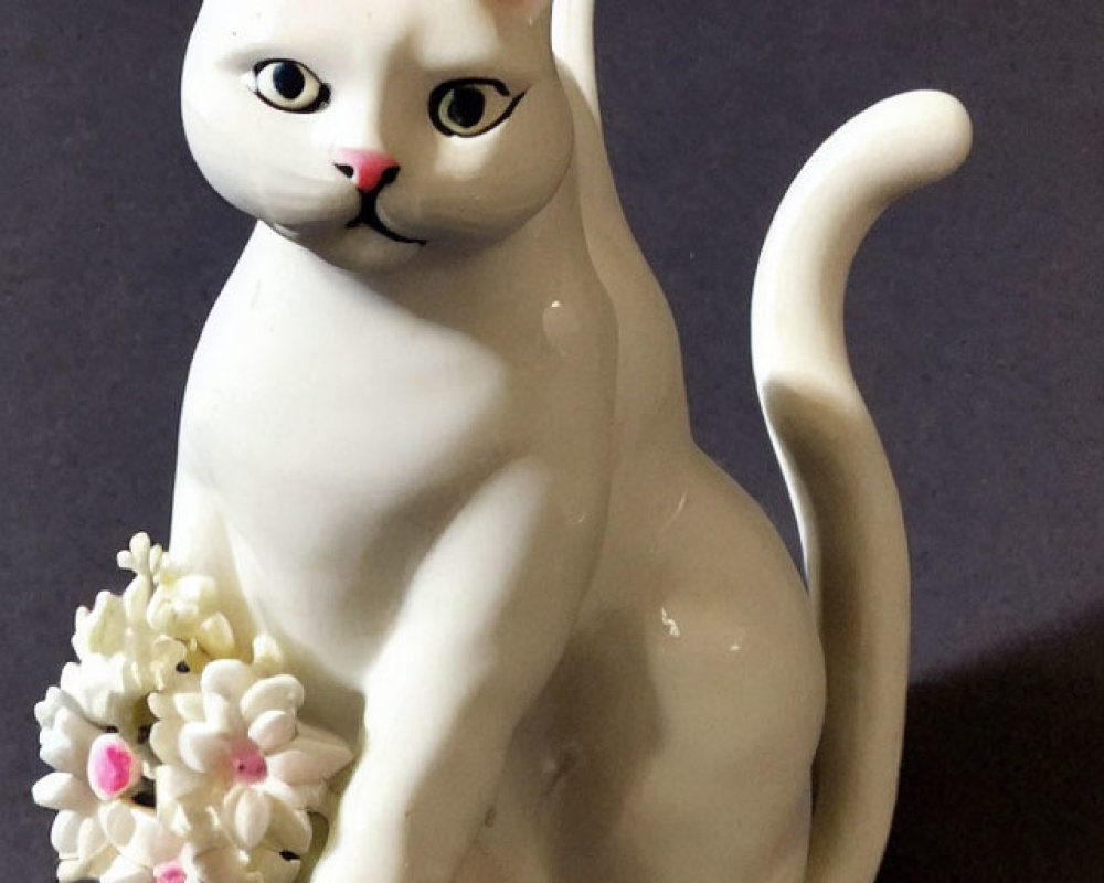 White Sitting Cat Porcelain Figurine with Pink Ears and Flower Bouquet