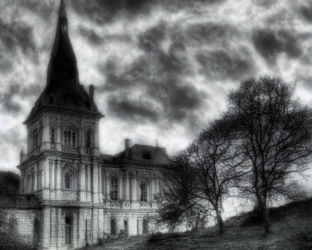 Monochrome image of vintage building with spire under dramatic sky