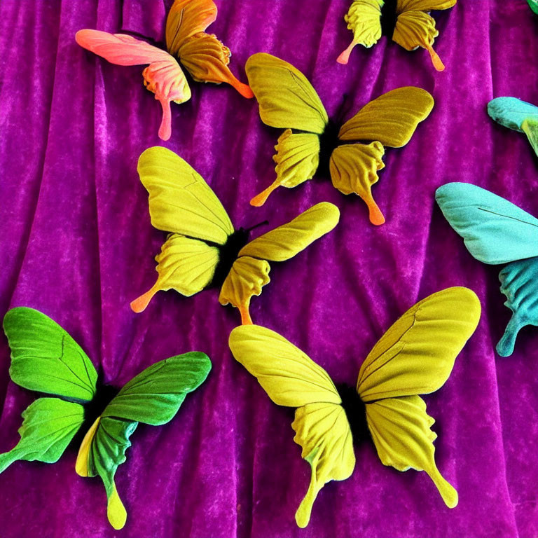 Vibrant Butterfly Decorations on Purple Velvet Surface