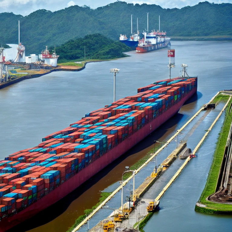 Container ships passing through canal lock system with lush greenery in background