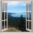 Fantasy landscape painting with castle, hills, and mountains viewed through open window