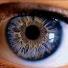 Surreal image: sky, clouds, eye shape, moon in pupil