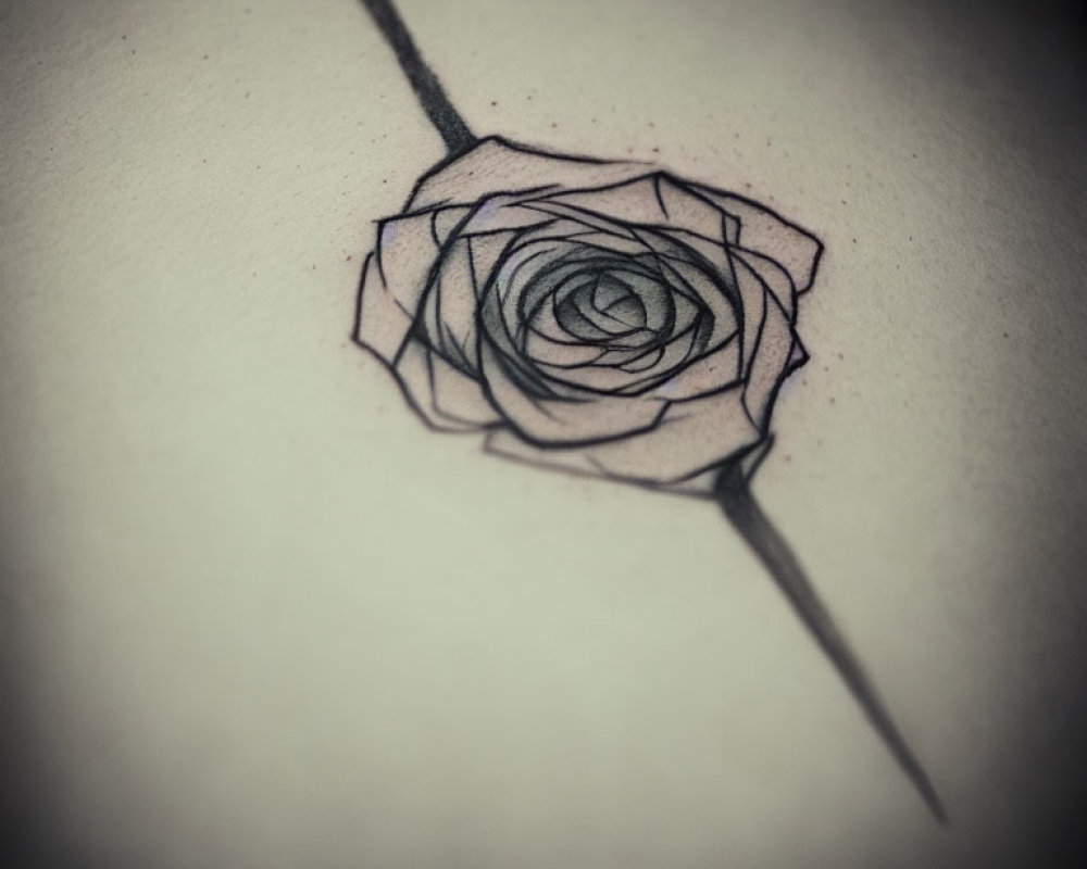 Geometric-style rose tattoo with intricate line work