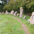 Colorful Standing Stones in Grassy Field