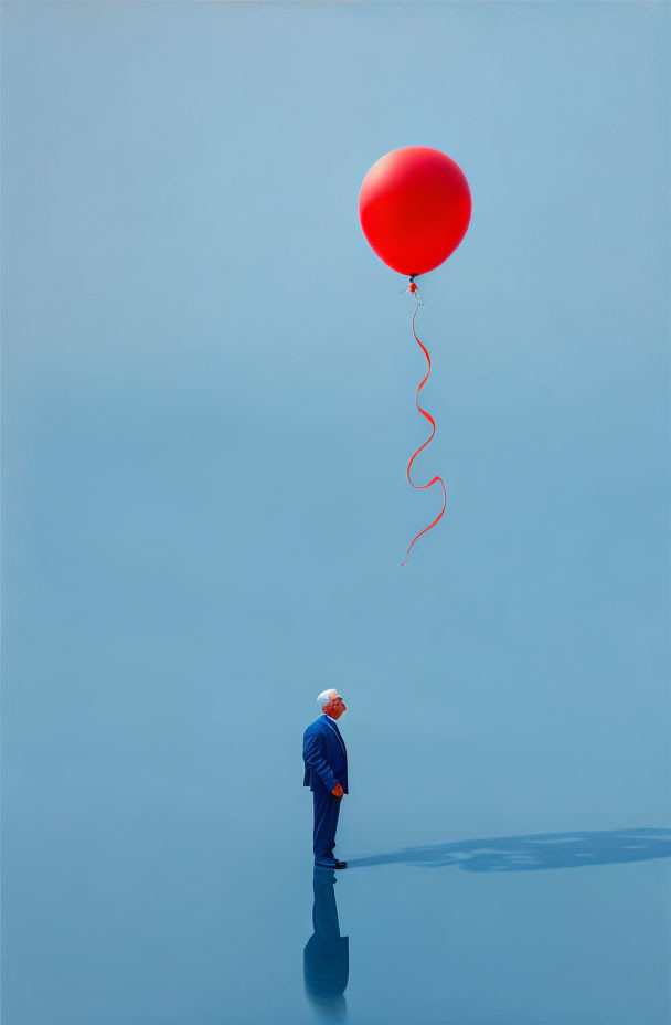 Man in suit gazes at large red balloon on blue backdrop