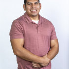 Man in Geometric Shirt Contemplating on Blue Background