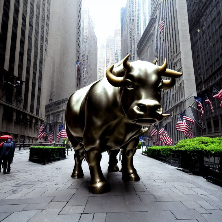 Bronze bull statue with American flags in narrow street symbolizes financial optimism.