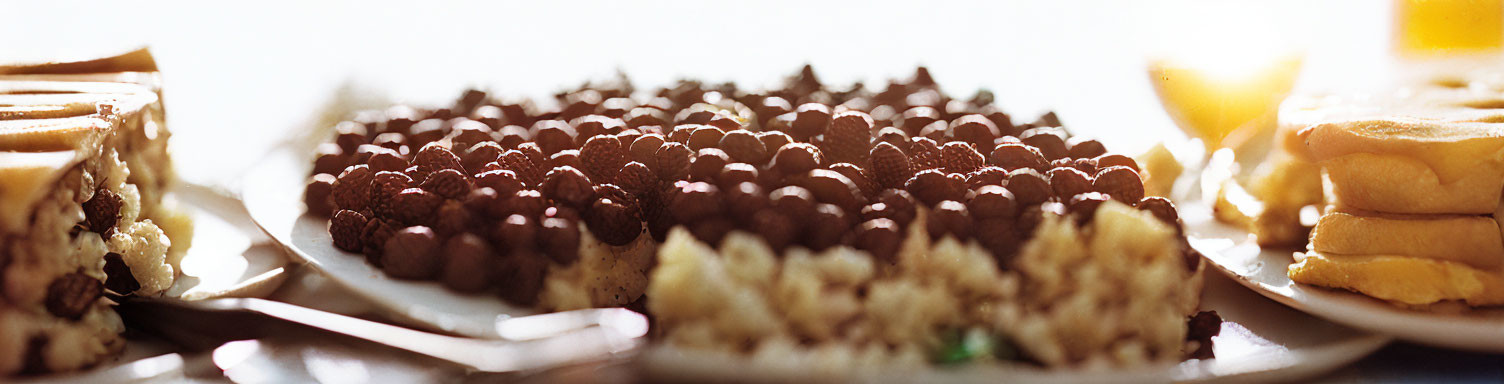 Assorted desserts with chocolate chips in soft lighting