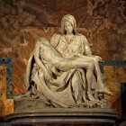 Golden and white seated woman statue with mirror and cherub on starry backdrop