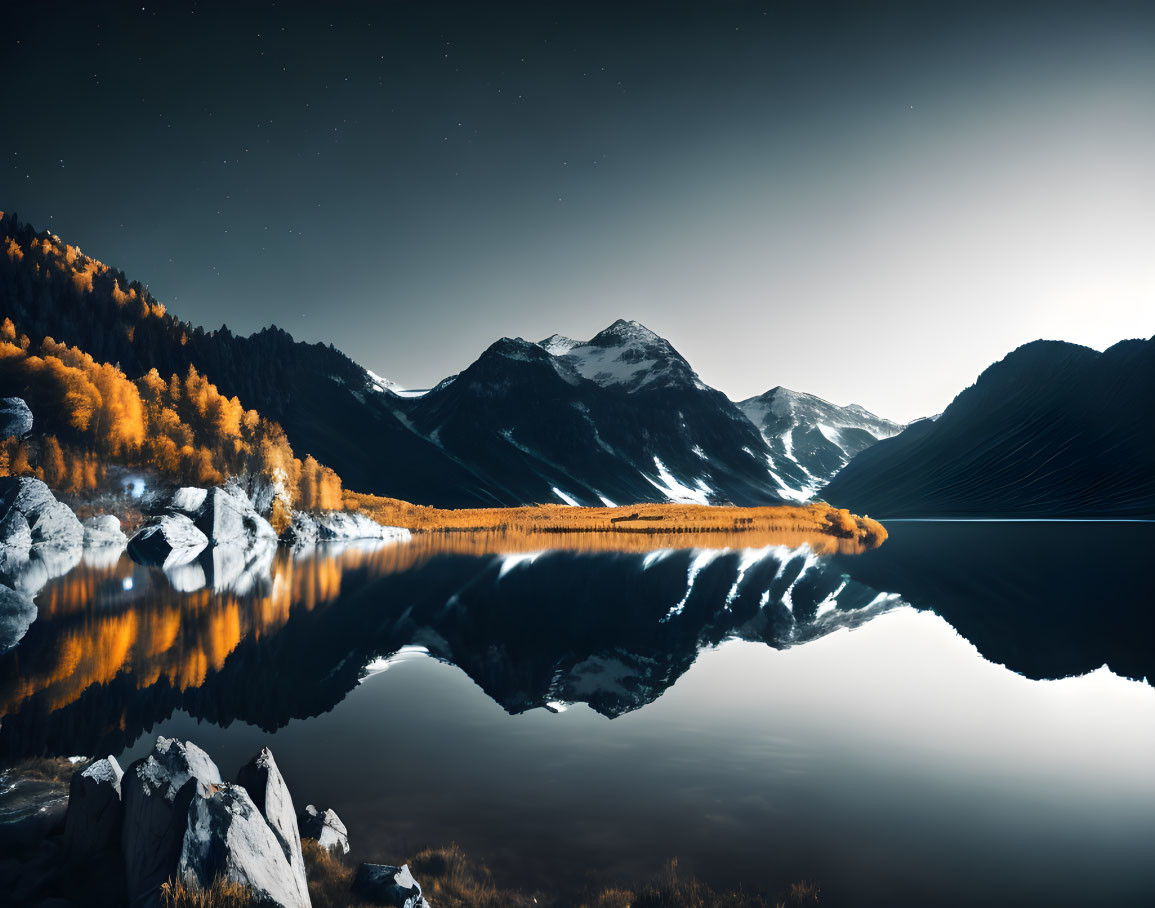 Tranquil night landscape with lake, mountains, and autumn trees