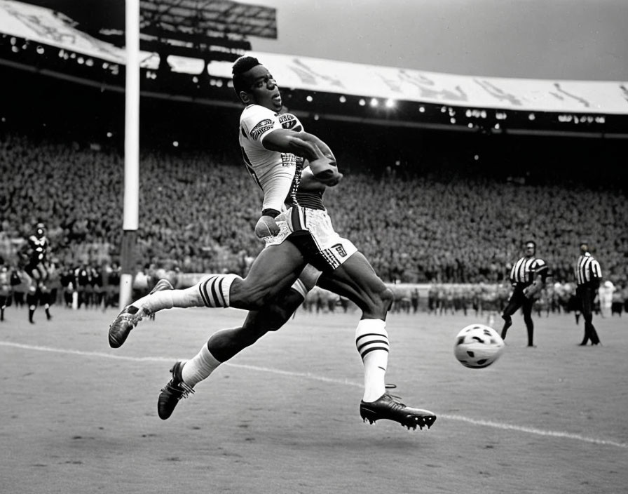 Soccer players mid-air competing in black-and-white stadium