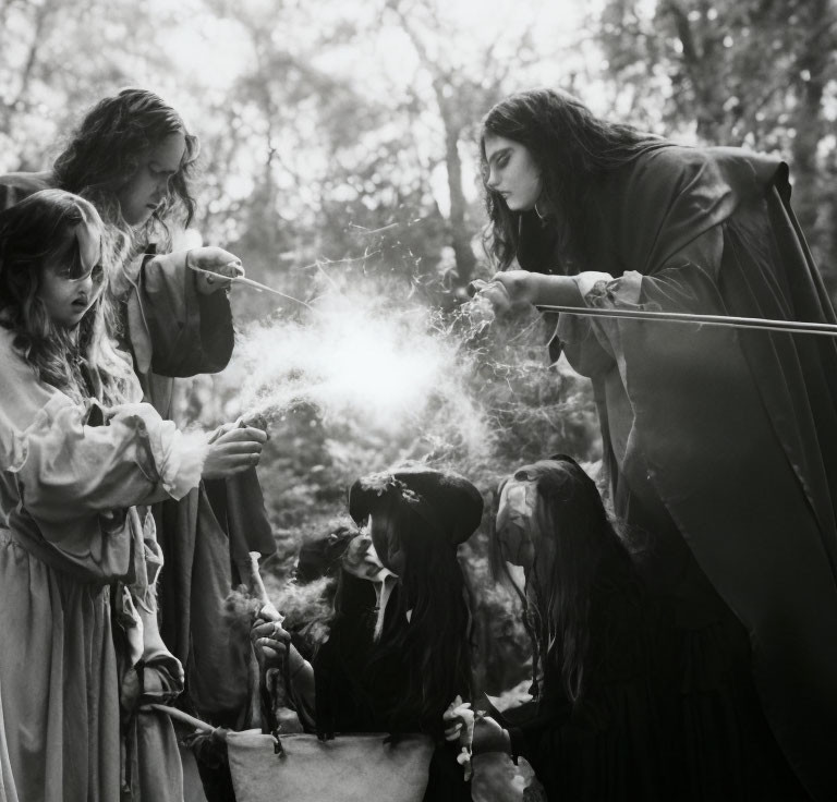 Group in medieval attire casting spell in forest