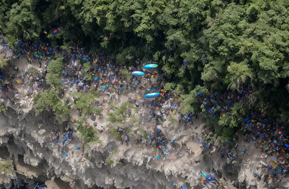 Crowded River Bank with Dense Foliage and Colorful Kayaks