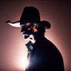 Mysterious Cowboy Hat Figure with Glowing Red Eyes