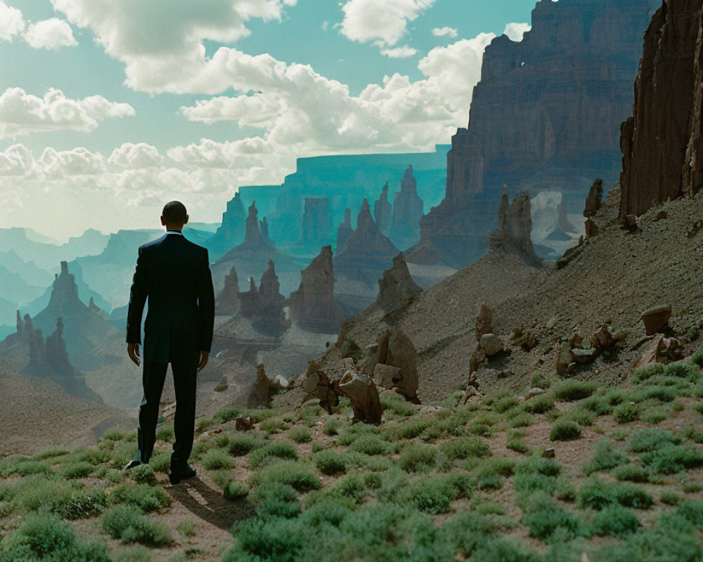 Business person in suit in desert landscape with rocky formations under blue sky.