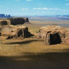 Panoramic desert landscape with rocky formations and clear blue sky