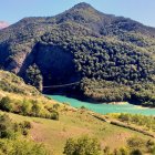 Alien landscape with blue cave entrance and mysterious figure