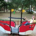 Colorful illustration: Two women in red boat in whimsical forest