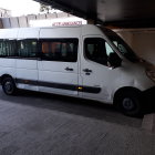 Decrepit Bus in Dystopian Landscape with Humanoid Figure