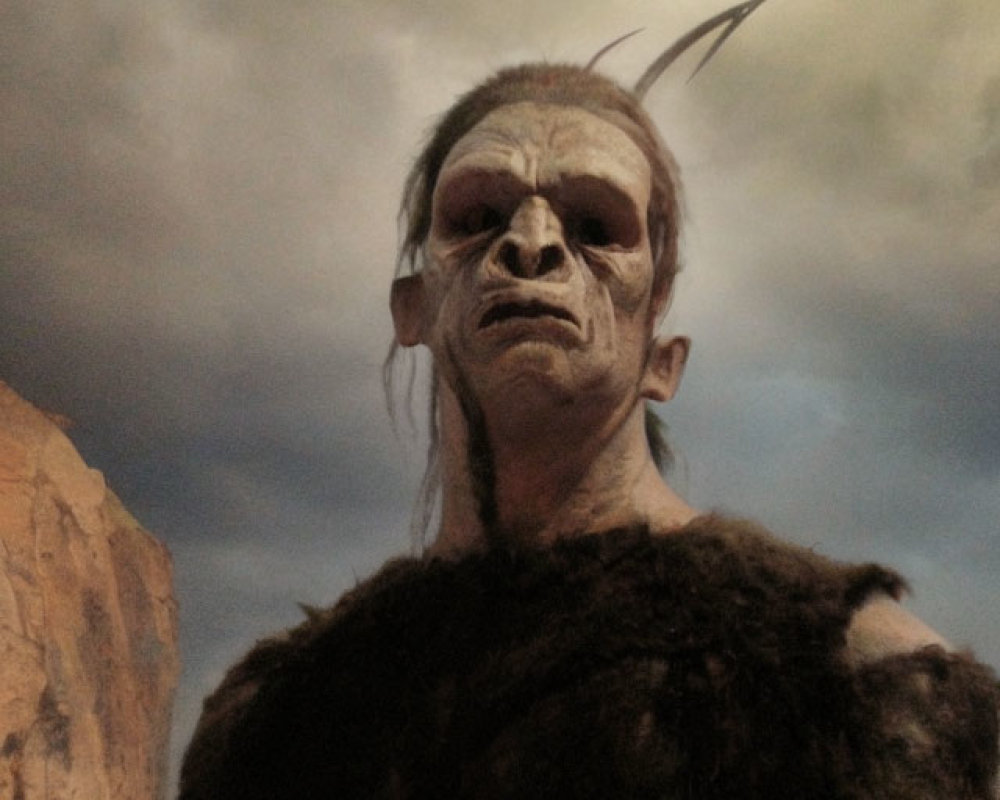 Person in Orc-Like Costume with Prosthetic Forehead and Pointed Ears