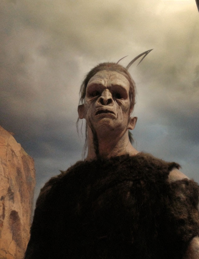 Person in Orc-Like Costume with Prosthetic Forehead and Pointed Ears