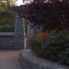 Ancient Stone Archway Covered in Purple Flowers in Serene Garden